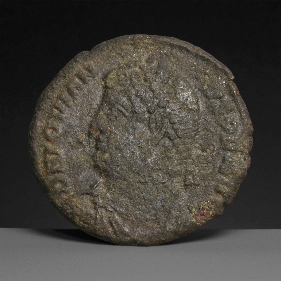 ROMAN EMPIRE: Imperial Authority - Bronze Coin, c. 1st-3rd Century AD, 19mm: Struck during the turbulent decades of the later Roman Empire, this 19mm bronze coin reflects the enduring symbolism of imperial control amidst crisis. Its compact yet deliberate design likely feature