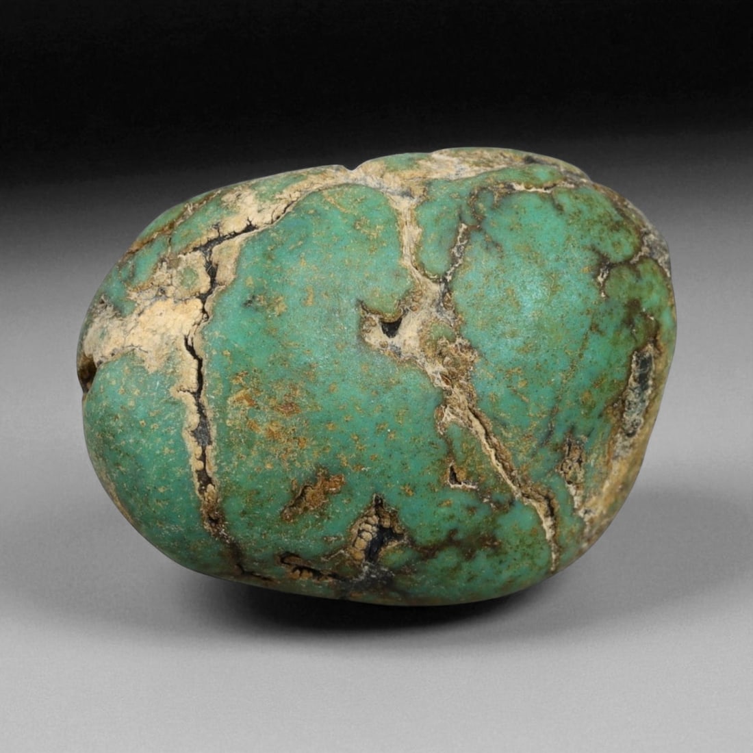 Antique Tibetan Mala Prayer Turquoise Amulet Bead, c. 18th-19th Century, 2.4cm: This striking turquoise bead from Tibet, dating to the 18th-19th century, embodies the deep spiritual and cultural reverence accorded to this precious stone in Himalayan tradition. Its organic, rounde