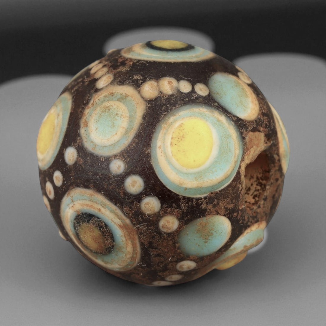 Ancient Chinese Warring States Eye Mosaic Glass Bead, Eastern Zhou, c. 475-221 BCE, 2.4cm: This rare mosaic glass eye bead, measuring 2.4 cm, comes from the Eastern Zhou Dynasty, Warring States period (c. 475-221 BCE). Beads of this type represent some of the earliest and most technically s