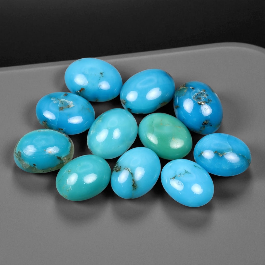 10.42 Carats Sky Blue Turquoise Cabochon Parcel - Natural Iranian Stones: This elegant parcel of turquoise cabochons showcases a radiant spectrum of sky to robin's-egg blue tones, interspersed with delicate matrix veining that adds natural character to each gem. Their smoot