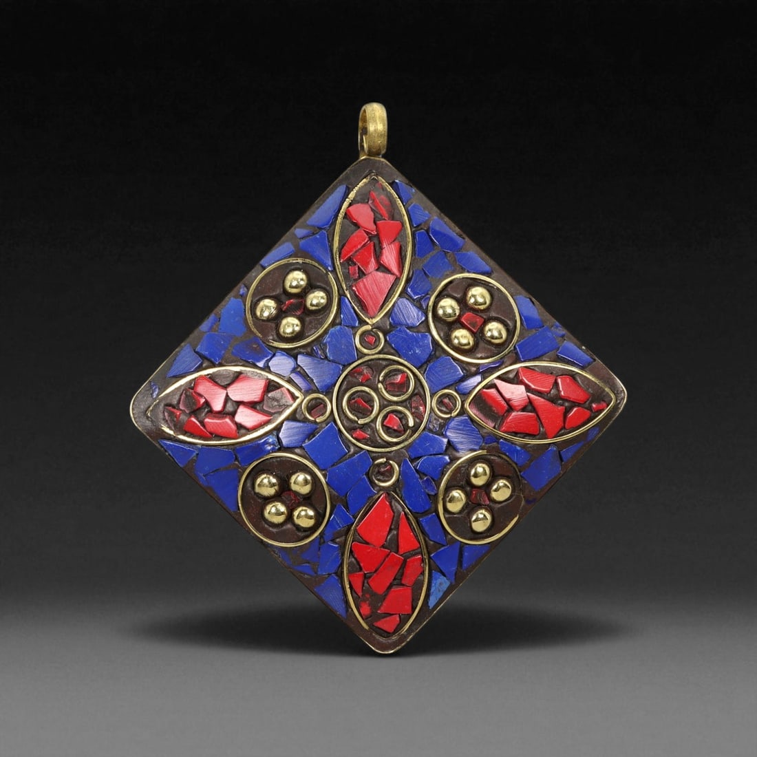 Vintage Himalayan Tribal Lapis and Coral Cross Motif Brass Pendant, 20th Century, 7cm: This striking diamond-shaped pendant exemplifies the vibrant geometry and sacred symbolism found in Himalayan tribal adornments. Its bold cross-like motif is formed through a meticulous inlay of deep-