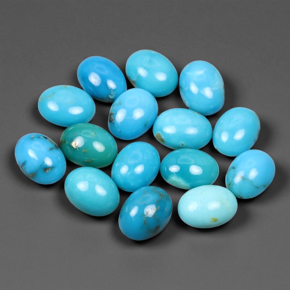 15.17 Carats Sky Blue Turquoise Cabochon Parcel - Natural Iranian Stones: This elegant parcel of turquoise cabochons showcases a radiant spectrum of sky to robin's-egg blue tones, interspersed with delicate matrix veining that adds natural character to each gem 8x6x3mm. The