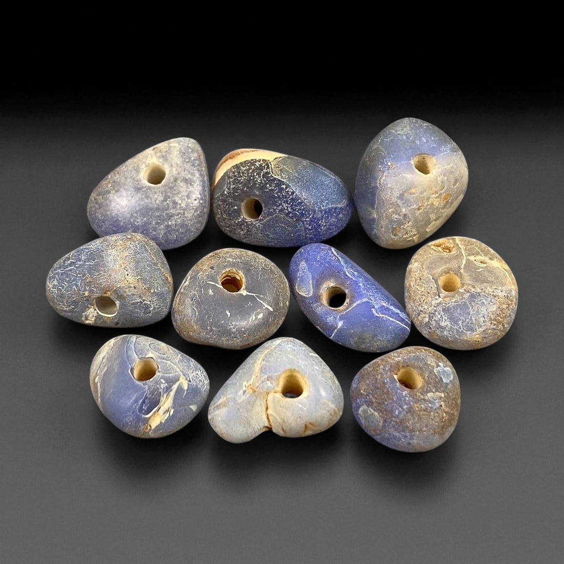 Ancient Mediterranean Chalcedony Trade Beads, c. 6th-4th Century BCE, 1.2-1.5cm: These ancient chalcedony beads, dating to the 6th-4th century BCE, originate from the Mediterranean trade networks that connected the Aegean, Levant, and North African coasts during the height of clas
