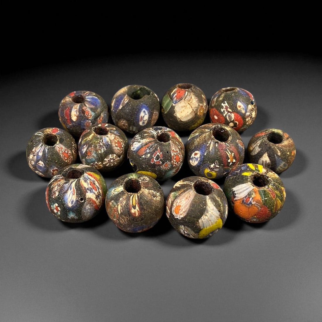 Antique Venetian Millefiori "End-of-the-Day" Glass Beads, c. 19th Century 2 cm: These antique Venetian "End-of-the-Day" millefiori beads, produced in the 19th century, exemplify the ingenuity and artistry of Murano glassmakers during Venice's peak export period. Crafted from mult