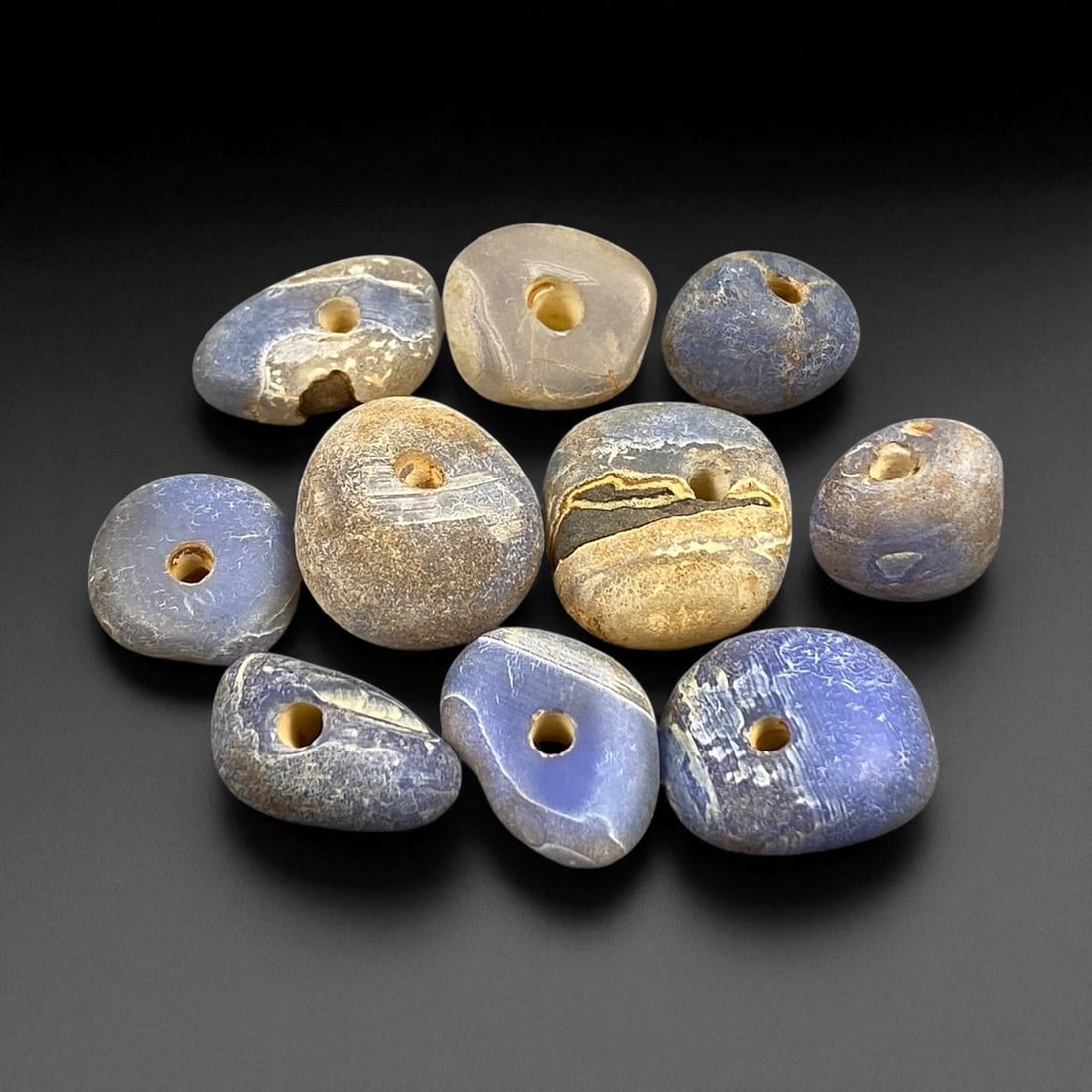 Ancient Mediterranean Chalcedony Trade Beads, c. 6th-4th Century BCE, 1.2-1.6cm: These ancient chalcedony beads, dating to the 6th-4th century BCE, originate from the Mediterranean trade networks that connected the Aegean, Levant, and North African coasts during the height of clas