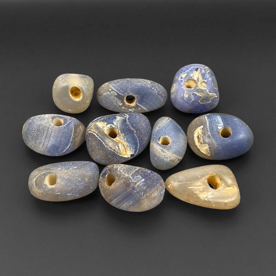 Ancient Mediterranean Chalcedony Trade Beads, c. 6th-4th Century BCE, 1-1.5cm: These ancient chalcedony beads, dating to the 6th-4th century BCE, originate from the Mediterranean trade networks that connected the Aegean, Levant, and North African coasts during the height of clas