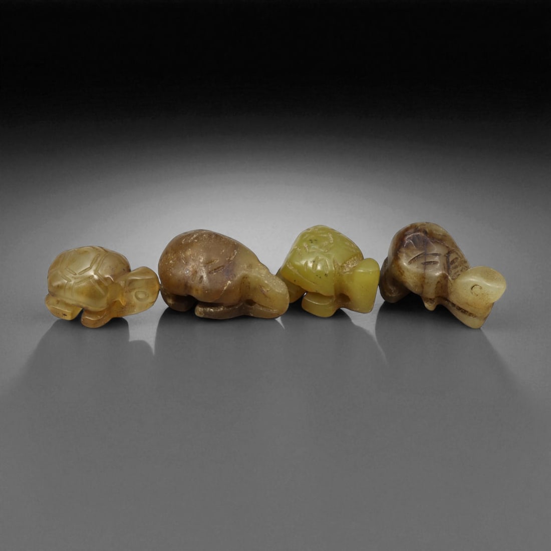 Antique Chinese Carved Jade Tortoise Charms, c. 19th Century, 1.7-2cm: This refined set of antique Chinese jade tortoise charms, dating from the 19th century, beautifully represents the enduring symbolism of longevity and protection in traditional Chinese culture. Each p