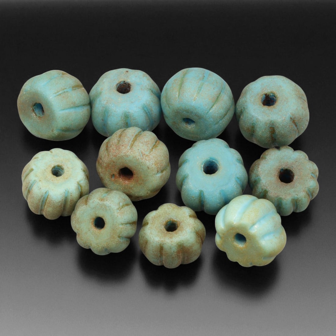 Antique Chinese Turquoise Faience Beads, c. 19th Century, 1.2-1.5cm: These antique Chinese turquoise faience beads, dating from the 19th century, are elegant examples of mineral-based craftsmanship inspired by early ceramic and stone traditions. Fashioned from finely g