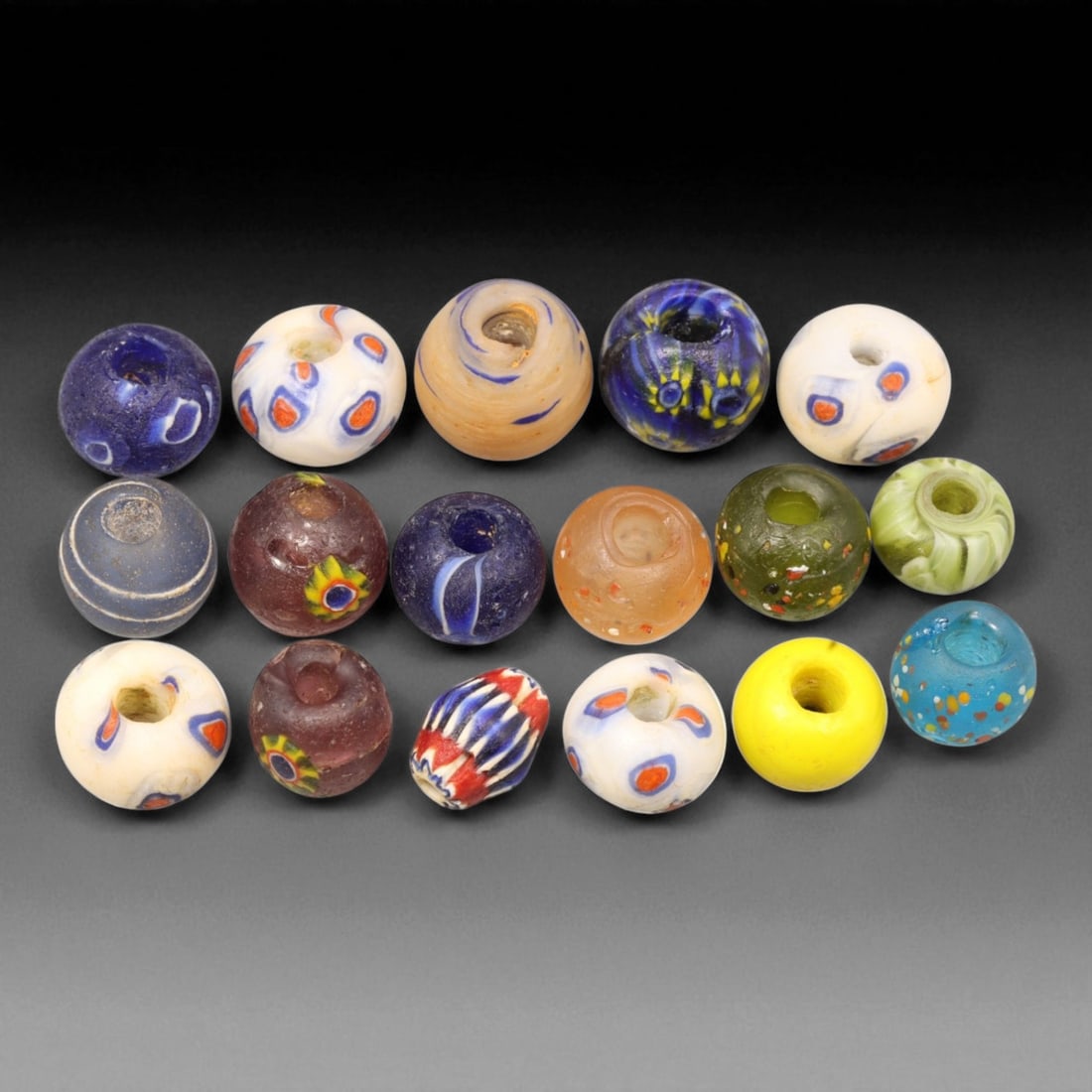 Antique Venetian Multicolor Murano Glass Trade Beads, c. 19th-20th Century, 1-1.5cm: This delightful collection of antique Venetian glass trade beads, dating from the 19th to early 20th century, reflects the rich color tradition and masterful artistry of Murano glassmakers. These bead