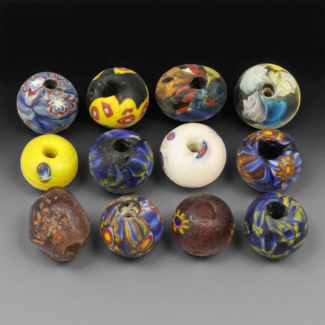 Antique Venetian Millefiori & Murano Glass Trade Beads, c. 19th Century, 1.2-1.6cm: This charming group of antique Venetian millefiori and Murano glass beads, dating from the 19th century, captures the height of Italy's glassmaking artistry during the golden age of global trade. Prod