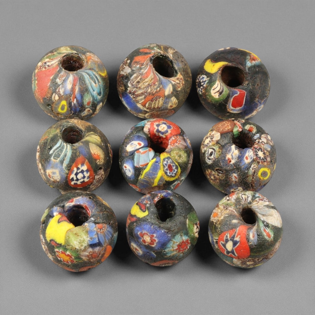 Antique Venetian Millefiori "End-of-the-Day" Glass Beads, c. 19th Century 2 cm: These antique Venetian "End-of-the-Day" millefiori beads, produced in the 19th century, exemplify the ingenuity and artistry of Murano glassmakers during Venice's peak export period. Crafted from mult