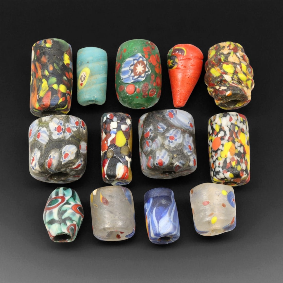 Antique Venetian Multicolor Millefiori and Mosaic Glass Trade Beads, c. 19th Century, 1.7-2cm: This vibrant collection of antique Venetian glass trade beads, dating from the 19th century, captures the full creative energy of Murano's glassmaking tradition. Produced during the height of Venetian