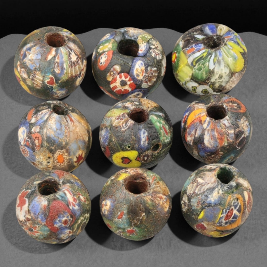 Antique Venetian Millefiori "End-of-the-Day" Glass Beads, c. 19th Century 2 cm: These antique Venetian "End-of-the-Day" millefiori beads, produced in the 19th century, exemplify the ingenuity and artistry of Murano glassmakers during Venice's peak export period. Crafted from mult