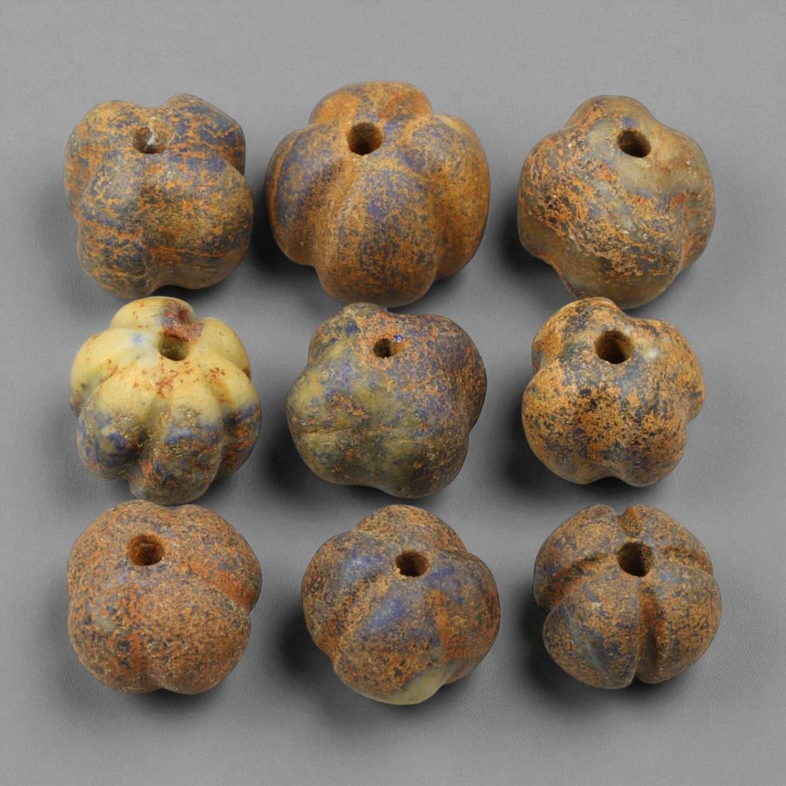 Ancient Bactrian Melon-Form Lapis Lazuli Beads, c. 2nd Millennium BCE, 1-1.5cm: These exquisite melon-form beads, carved from lapis lazuli during the 2nd millennium BCE, originate from the ancient Bactrian region-one of Central Asia's most culturally refined Bronze Age civilizati