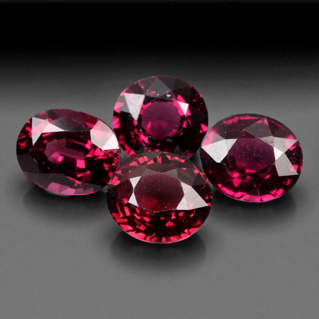 8.10 Carats Deep Red Faceted Garnet Parcel - Natural Mozambique Stones: This richly colored parcel of faceted garnets glows with a deep crimson tone accented by flashes of wine-red brilliance. Each oval gem, averaging 8x7x4 mm, captures light with elegant depth and intern