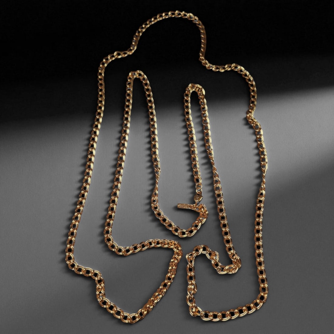 Antique Monet Double-Link Gold-Tone Chain Necklace, c. Mid-20th Century, 60cm, 78g: This refined Monet gold-tone necklace, measuring 60 cm in length, exemplifies the bold yet balanced design language of mid-20th century American costume jewelry. The piece showcases Monet's signature