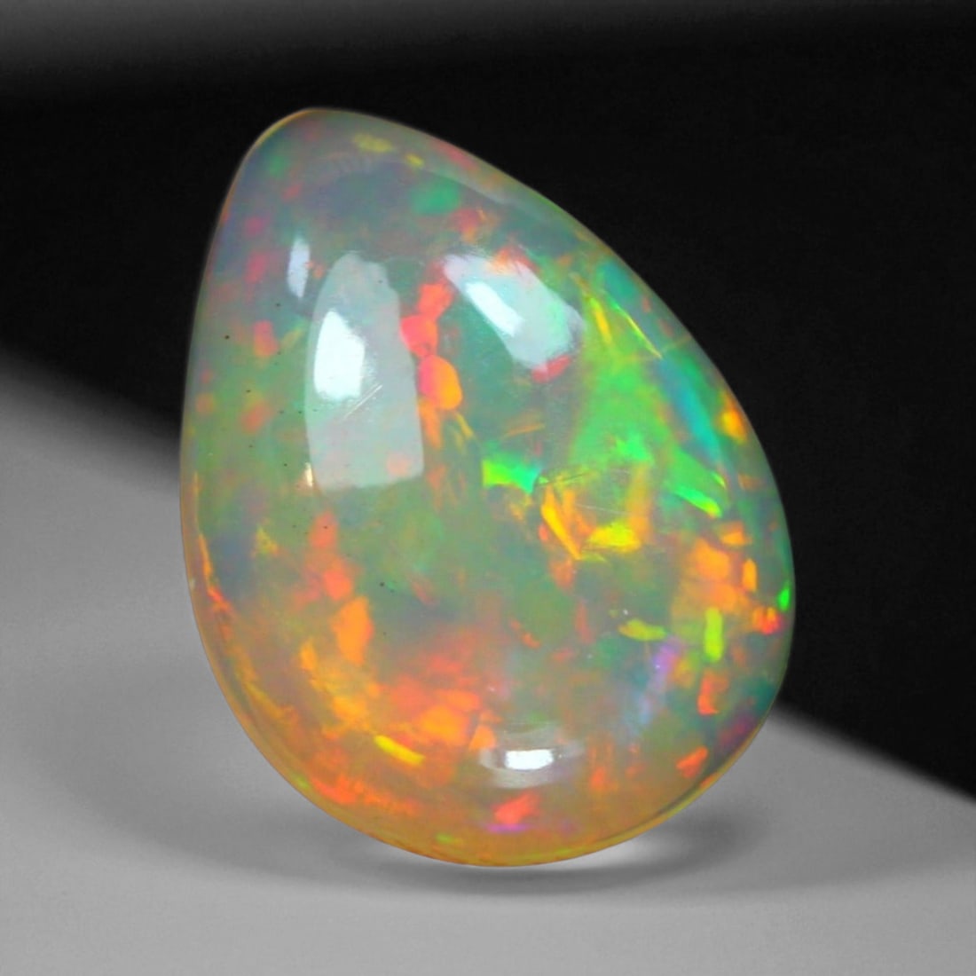 3.40 Carats Multi-Color Welo Opal Lot - Natural Ethiopian Stones: This radiant group of Welo opals displays a mesmerizing interplay of color that dances across the surface with every shift of light. Electric flashes of green, orange, and red ripple through a translu