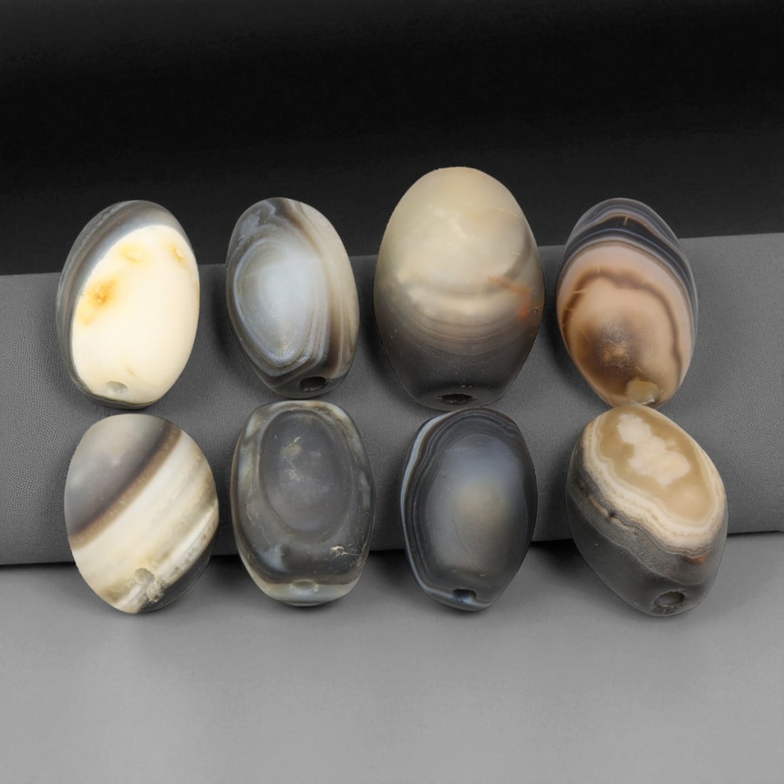 Antique Indo-Tibetan Sulaimani Agate Oval Beads, c. 19th Century, 2-2.4cm: These refined antique Sulaimani agate beads, dating to the 19th century, originate from the Indo-Tibetan cultural sphere, where such stones were prized for their spiritual resonance and natural beauty