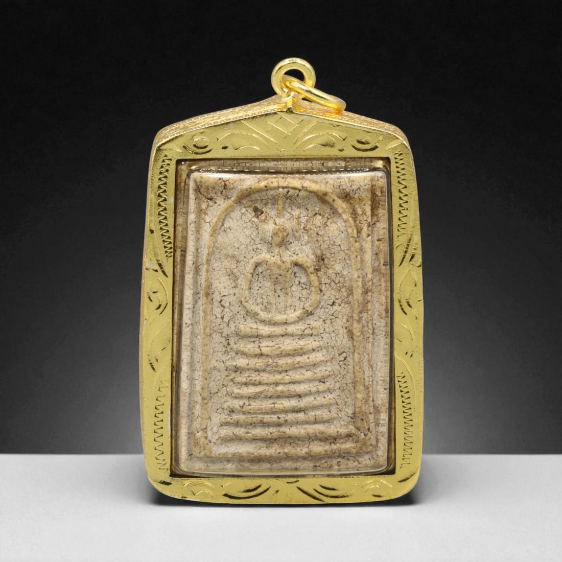 Thai Temple Gilt Buddhist Amulet in Ornate Gold-Tone Frame, 5cm: This beautifully crafted gilt Buddhist amulet is enclosed within an intricately designed gold-tone frame, combining sacred symbolism with refined artistry. The detailed relief and lustrous finish refl