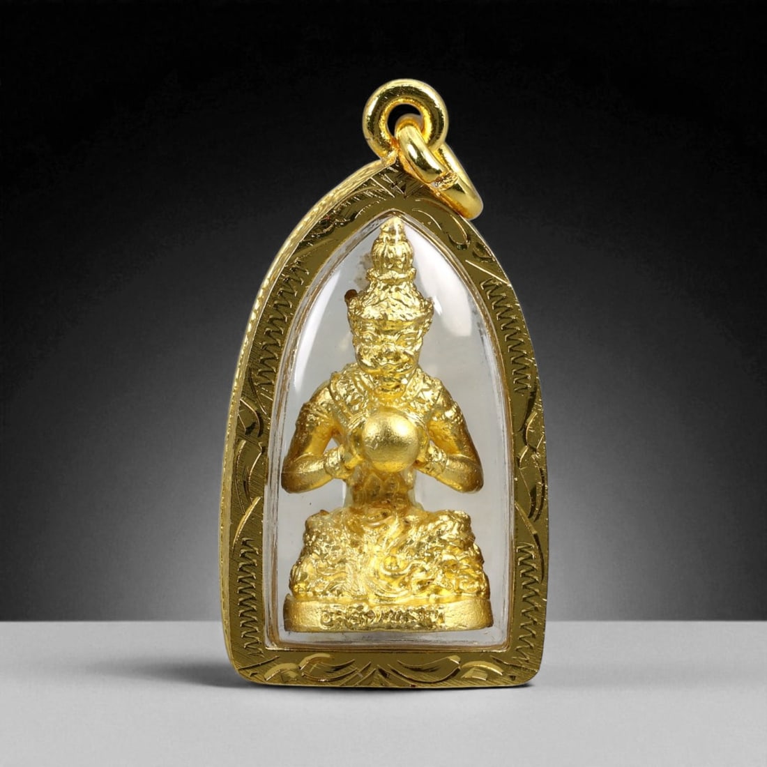 Thai Temple Gilt Buddhist Amulet in Ornate Gold-Tone Frame, 4cm: This beautifully crafted gilt Buddhist amulet is enclosed within an intricately designed gold-tone frame, combining sacred symbolism with refined artistry. The detailed relief and lustrous finish refl