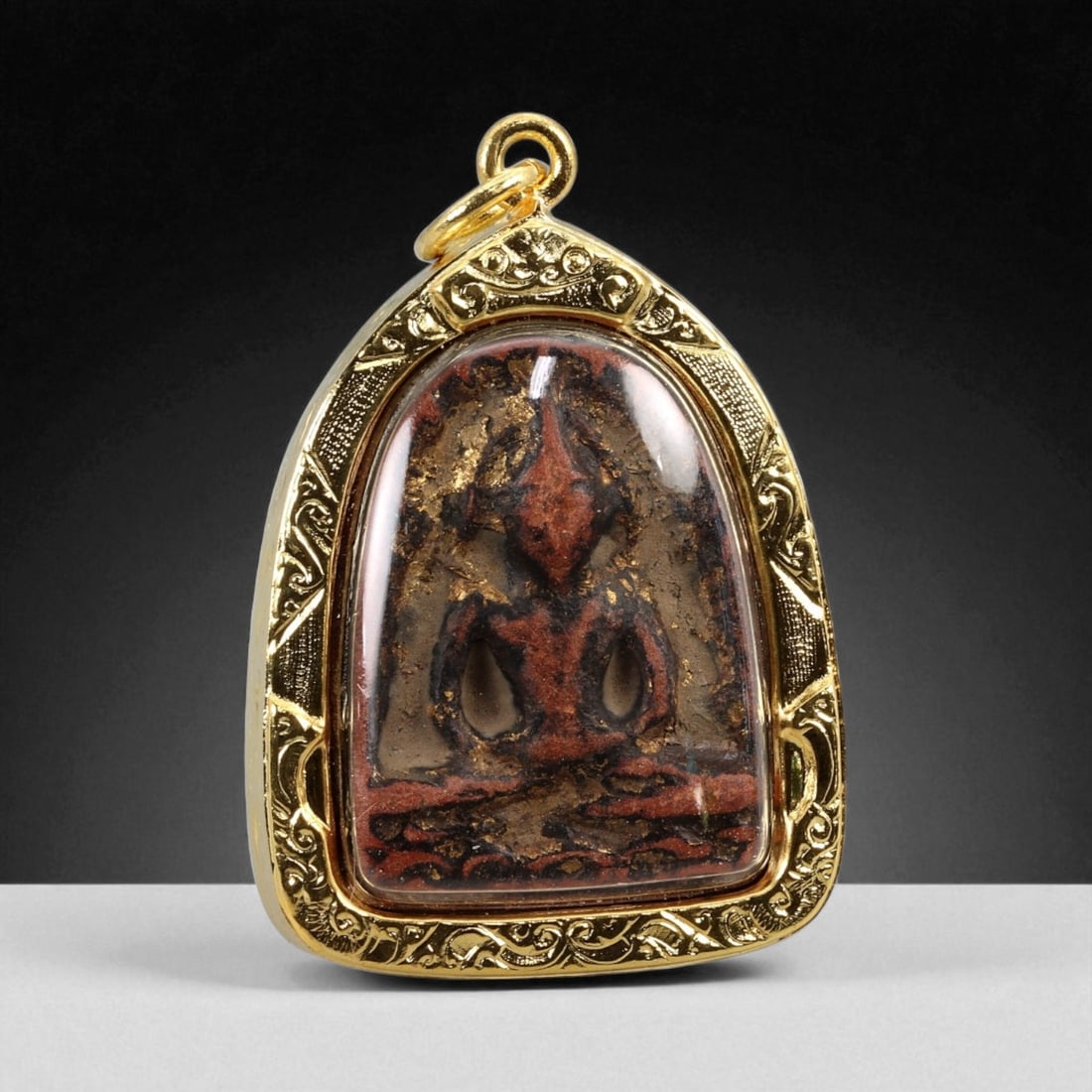Thai Temple Style Gilt Buddhist Amulet in Ornate Gold-Tone Frame, 4.6cm: This beautifully crafted gilt Buddhist amulet is enclosed within an intricately designed gold-tone frame, combining sacred symbolism with refined artistry. The detailed relief and lustrous finish refl