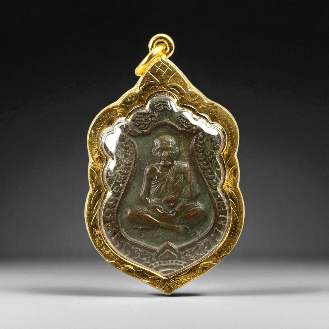 Thai Temple Style Gilt Buddhist Amulet in Ornate Gold-Tone Frame, 5.5cm: This beautifully crafted gilt Buddhist amulet is enclosed within an intricately designed gold-tone frame, combining sacred symbolism with refined artistry. The detailed relief and lustrous finish refl