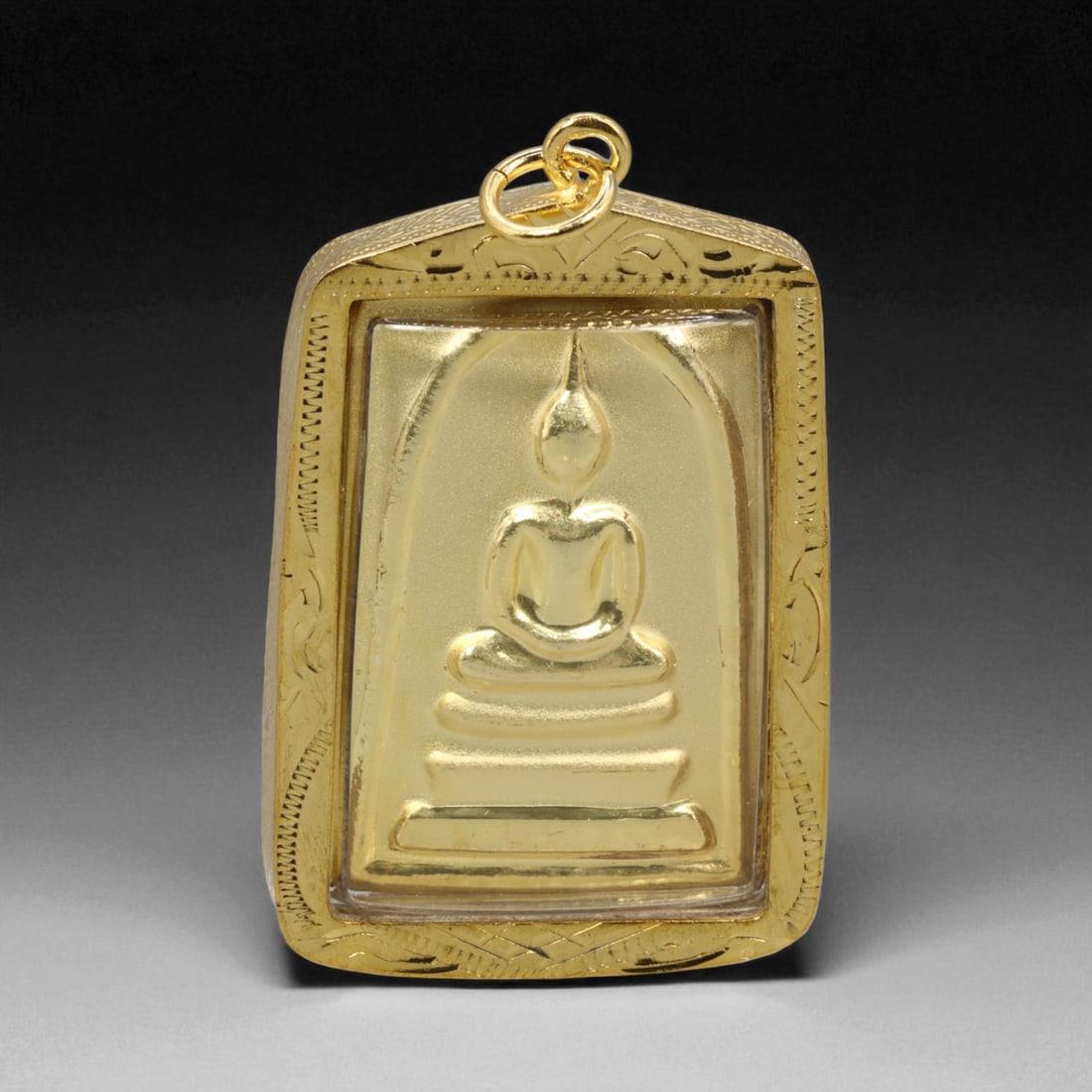 Thai Temple Gilt Buddhist Amulet in Ornate Gold-Tone Frame, 5cm: This beautifully crafted gilt Buddhist amulet is enclosed within an intricately designed gold-tone frame, combining sacred symbolism with refined artistry. The detailed relief and lustrous finish refl