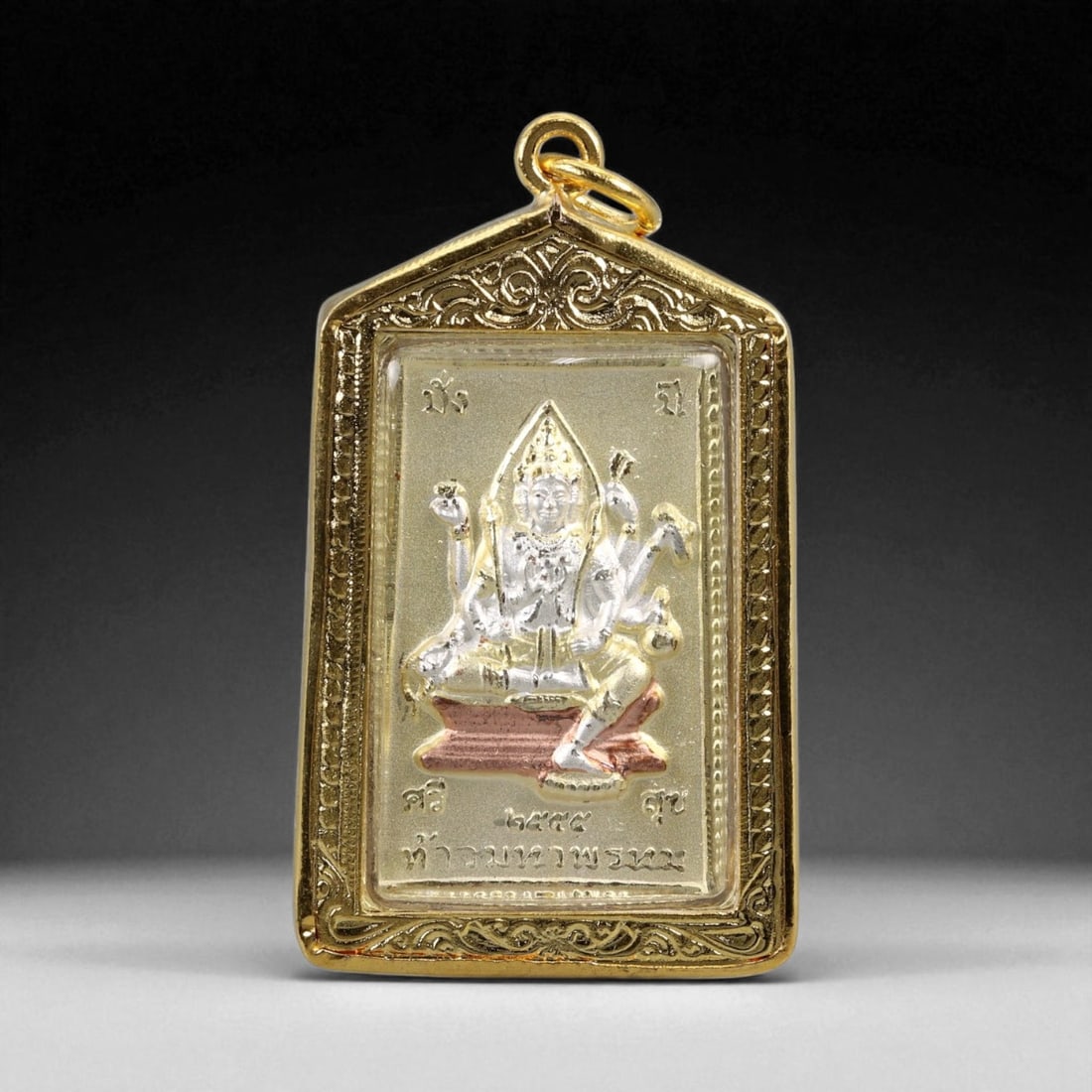 Thai Temple Style Gilt Buddhist Amulet in Ornate Gold-Tone Frame, 5.2cm: This beautifully crafted gilt Buddhist amulet is enclosed within an intricately designed gold-tone frame, combining sacred symbolism with refined artistry. The detailed relief and lustrous finish refl