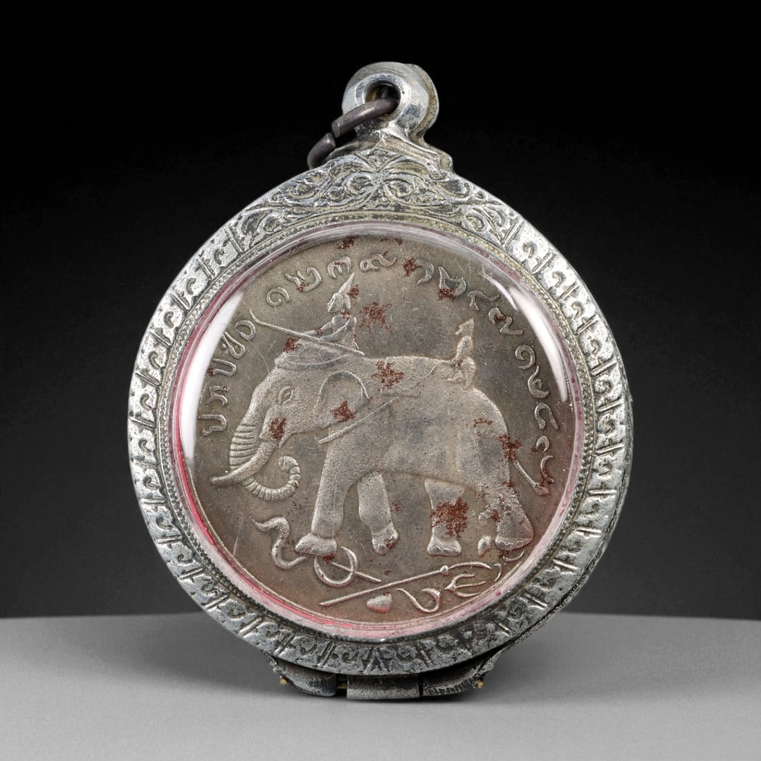 Vintage Thai Buddhist Amulet in Ornate Framed Setting, 20th Century, 6cm: This vintage Thai Buddhist amulet exemplifies the devotional artistry that continues to define Thailand's sacred craftsmanship. Encased within an intricately detailed frame, the amulet displays refine
