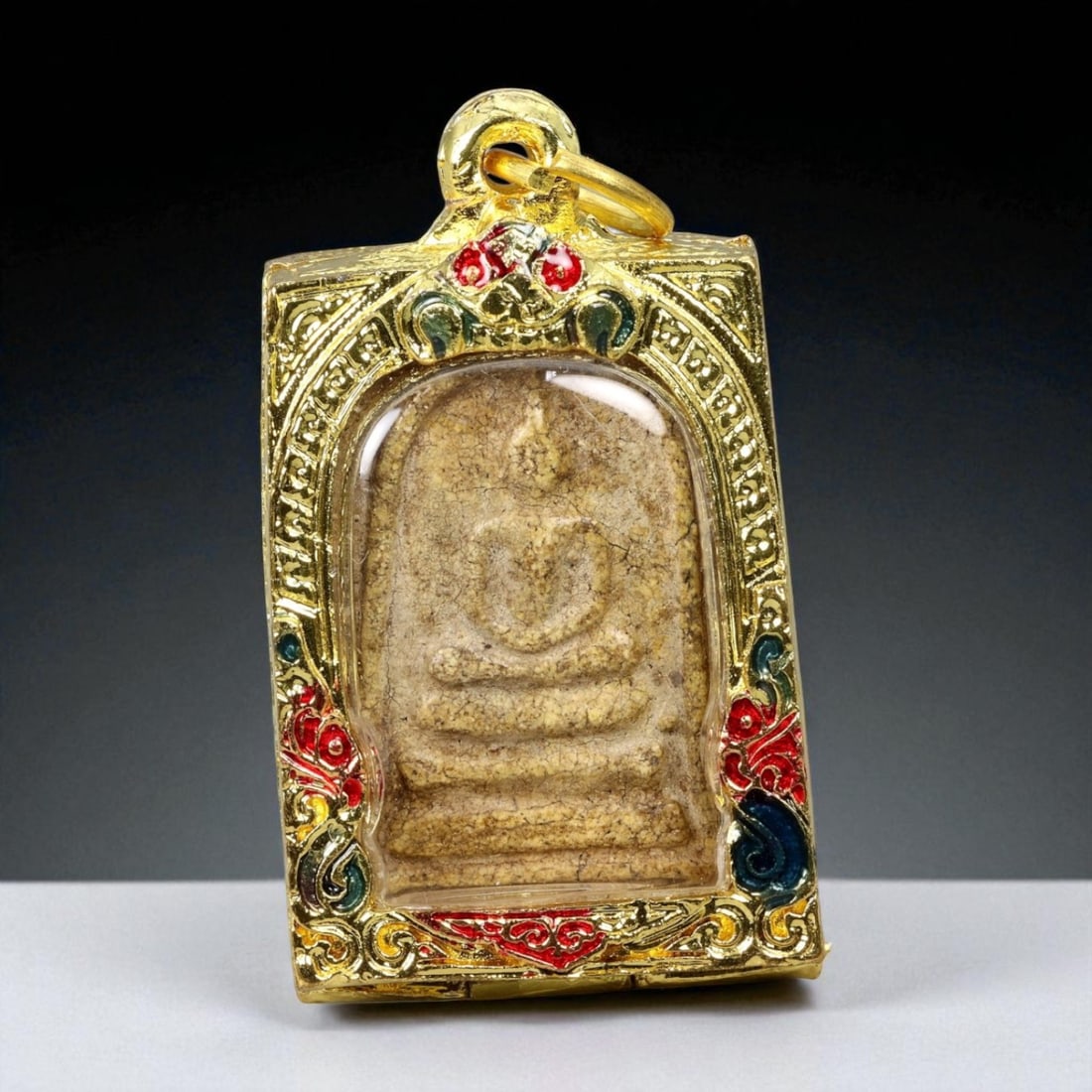Thai Temple Gilt Buddhist Amulet in Ornate Gold-Tone Frame, 6cm: This beautifully crafted gilt Buddhist amulet is enclosed within an intricately designed gold-tone frame, combining sacred symbolism with refined artistry. The detailed relief and lustrous finish refl