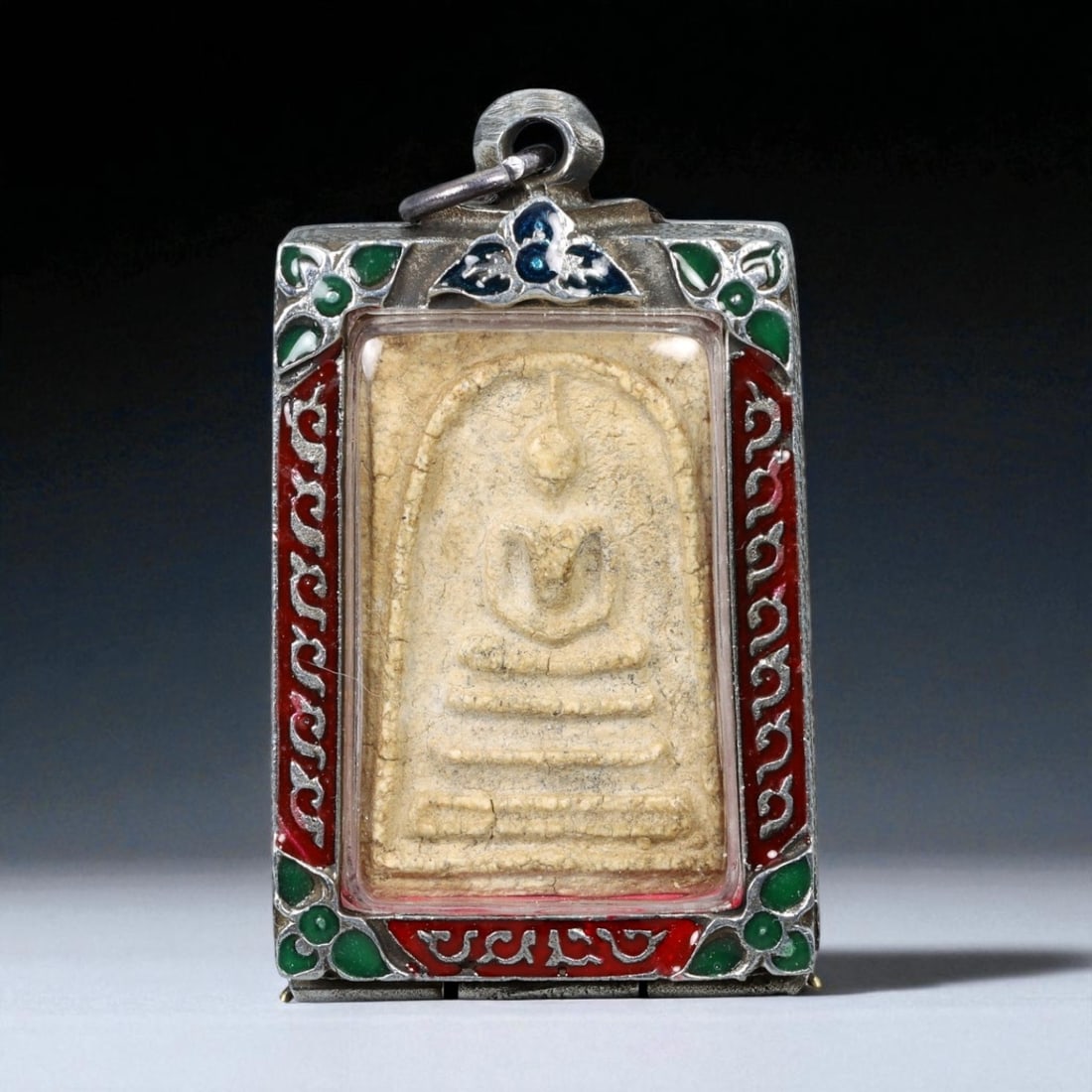 Vintage Thai Buddhist Amulet in Ornate Framed Setting, 20th Century, 6cm: This vintage Thai Buddhist amulet exemplifies the devotional artistry that continues to define Thailand's sacred craftsmanship. Encased within an intricately detailed frame, the amulet displays refine