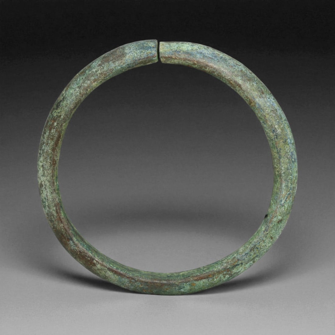 Ancient Roman Bronze Bracelet, c. 1st-3rd Century CE, 7cm, 84g: This ancient Roman bronze bracelet dates to the height of the Roman Empire, between the 1st and 3rd centuries CE, a time of expansive trade, engineering marvels, and refined metal craftsmanship. Bronz