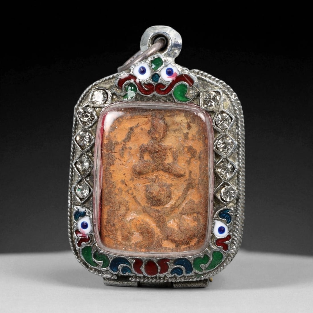 Vintage Thai Buddhist Amulet in Ornate Framed Setting, 20th Century, 5cm: This vintage Thai Buddhist amulet exemplifies the devotional artistry that continues to define Thailand's sacred craftsmanship. Encased within an intricately detailed frame, the amulet displays refine