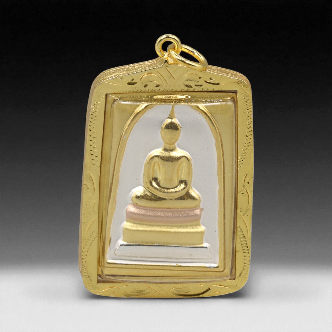 Thai Temple Gilt Buddhist Amulet in Ornate Gold-Tone Frame, 5cm: This beautifully crafted gilt Buddhist amulet is enclosed within an intricately designed gold-tone frame, combining sacred symbolism with refined artistry. The detailed relief and lustrous finish refl
