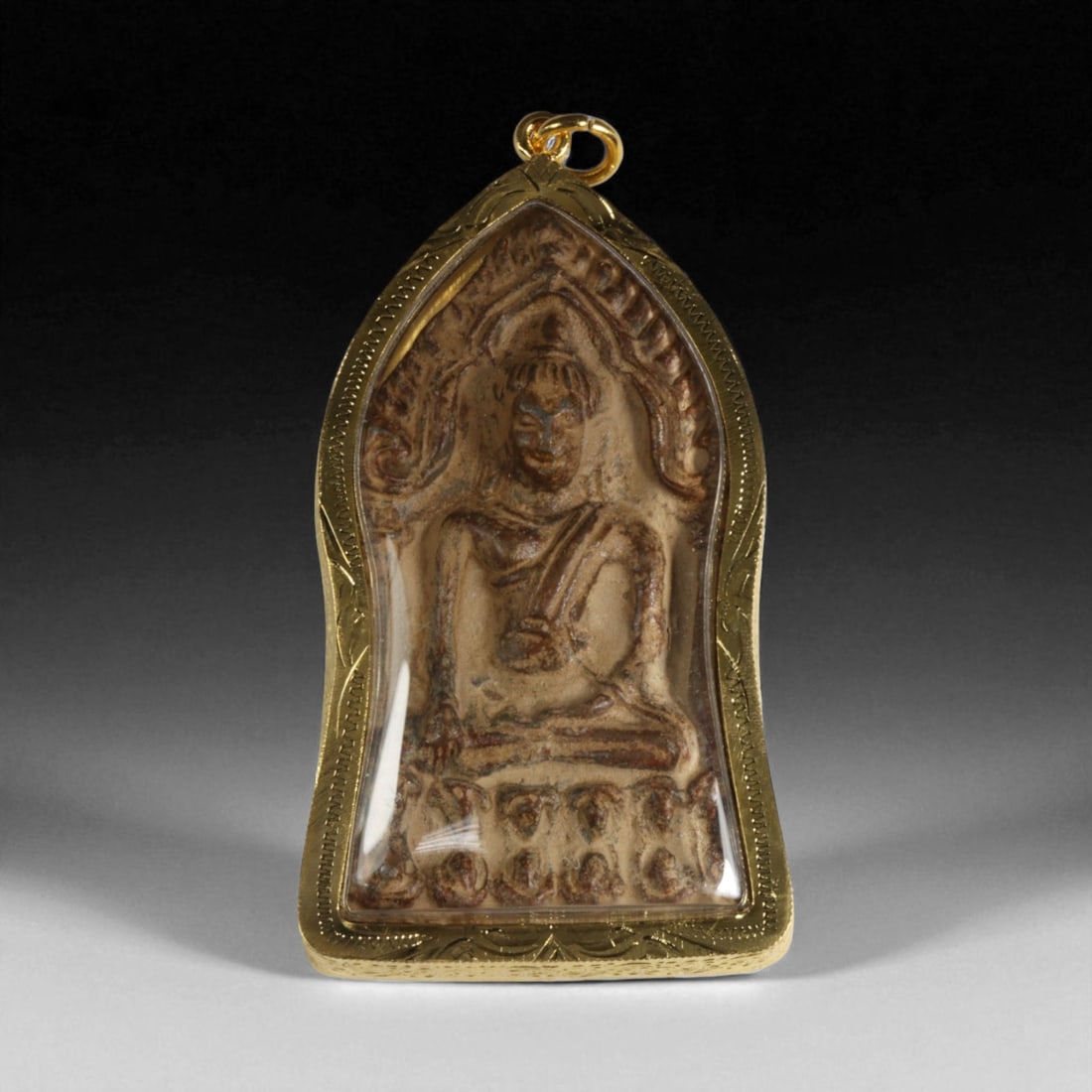 Antique Thai Buddha Amulet Clay Casting in Gilt Frame, 19th-20th Century, 56g: This antique Thai Buddhist amulet, crafted in the late Rattanakosin period (19th-20th century), embodies the profound devotion of Thailand's spiritual artisans. Molded from sacred clay, the amulet dep