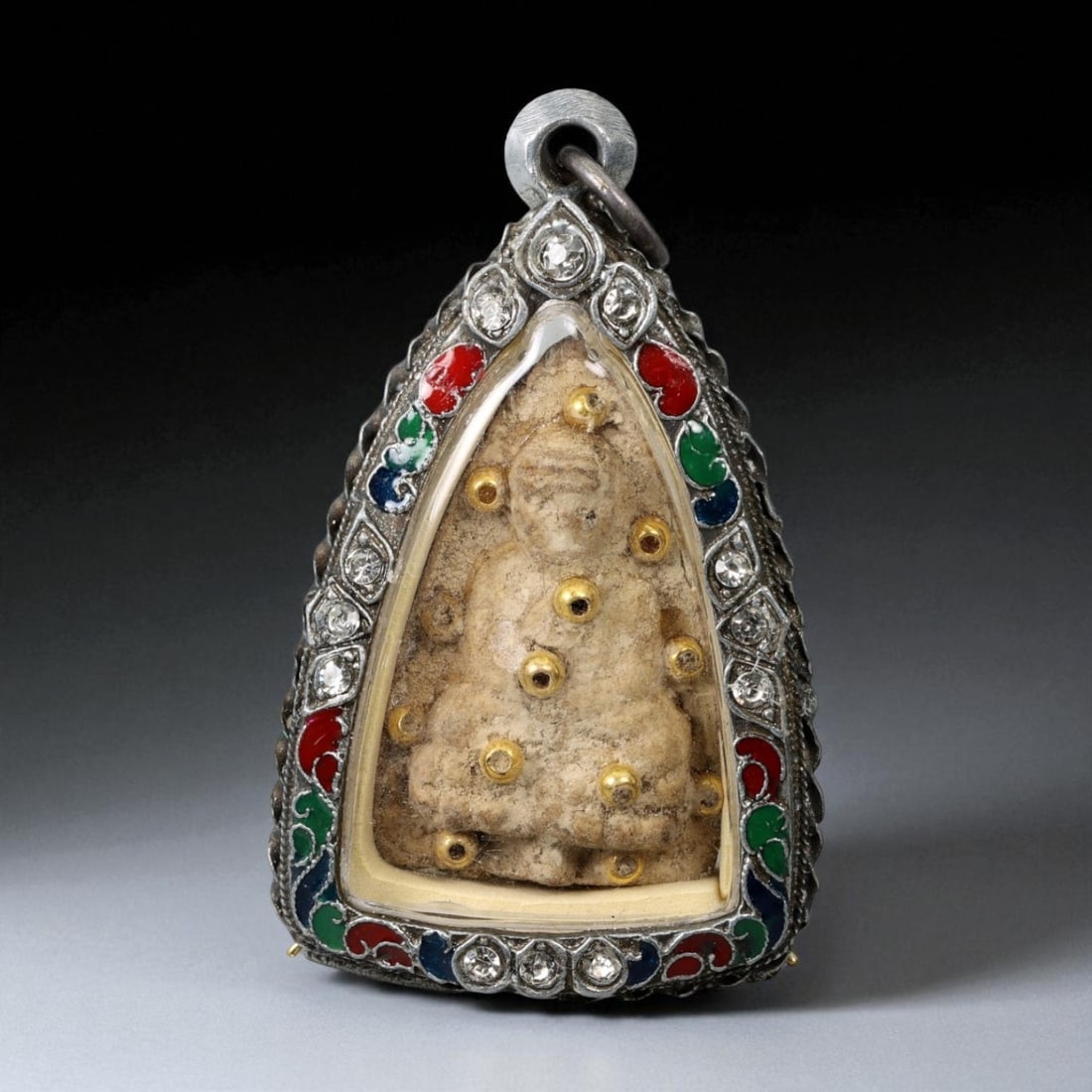 Vintage Thai Buddhist Amulet in Ornate Framed Setting, 20th Century, 6cm: This vintage Thai Buddhist amulet exemplifies the devotional artistry that continues to define Thailand's sacred craftsmanship. Encased within an intricately detailed frame, the amulet displays refine