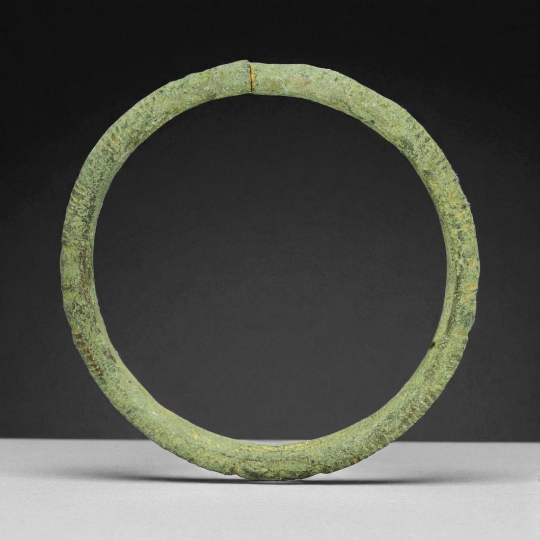 Ancient Roman Bronze Bracelet, c. 1st-3rd Century CE, 8cm, 55g: This ancient Roman bronze bracelet dates to the height of the Roman Empire, between the 1st and 3rd centuries CE, a time of expansive trade, engineering marvels, and refined metal craftsmanship. Bronz