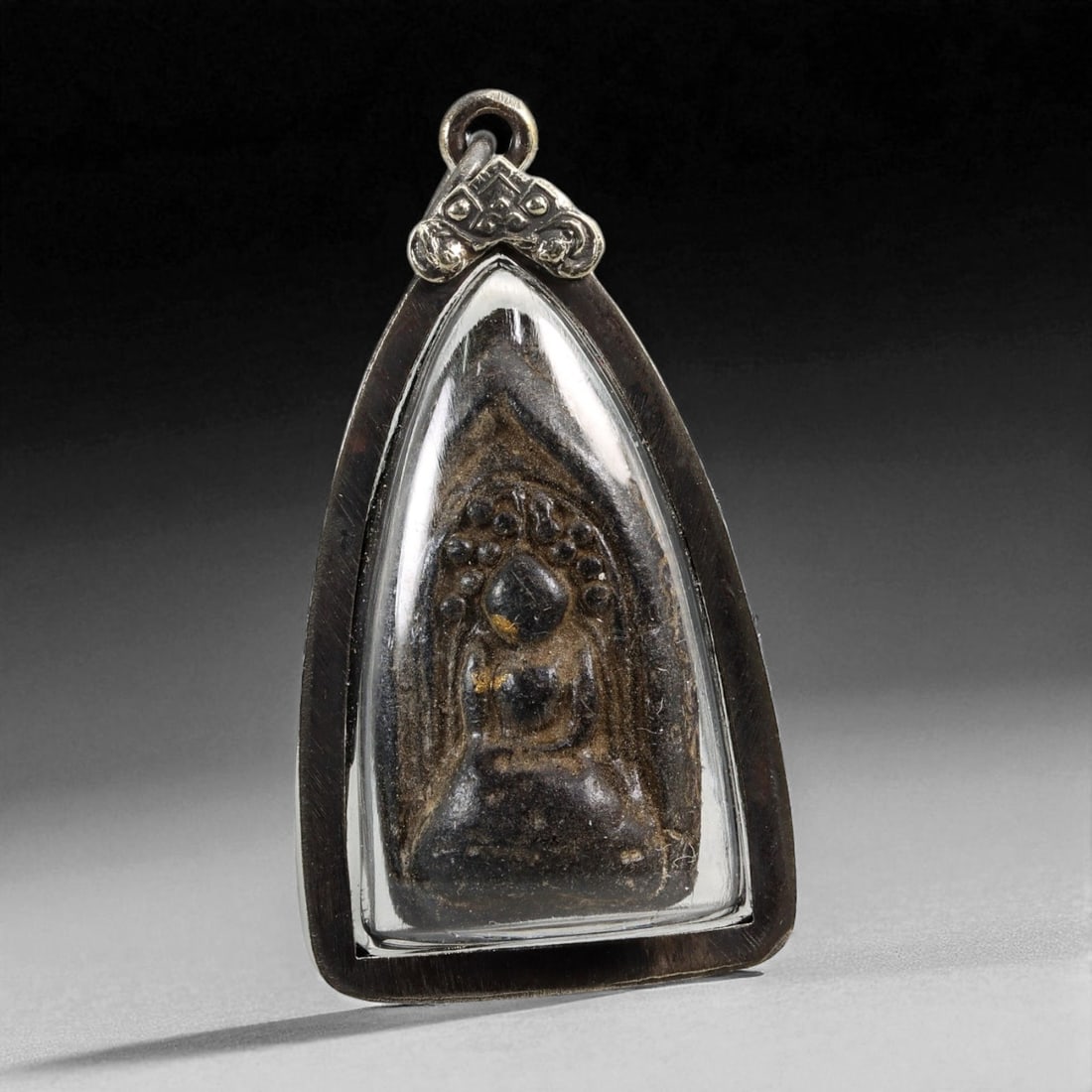 Vintage Thai Buddhist Amulet in Ornate Framed Setting, 20th Century, 5cm: This vintage Thai Buddhist amulet exemplifies the devotional artistry that continues to define Thailand's sacred craftsmanship. Encased within an intricately detailed frame, the amulet displays refine