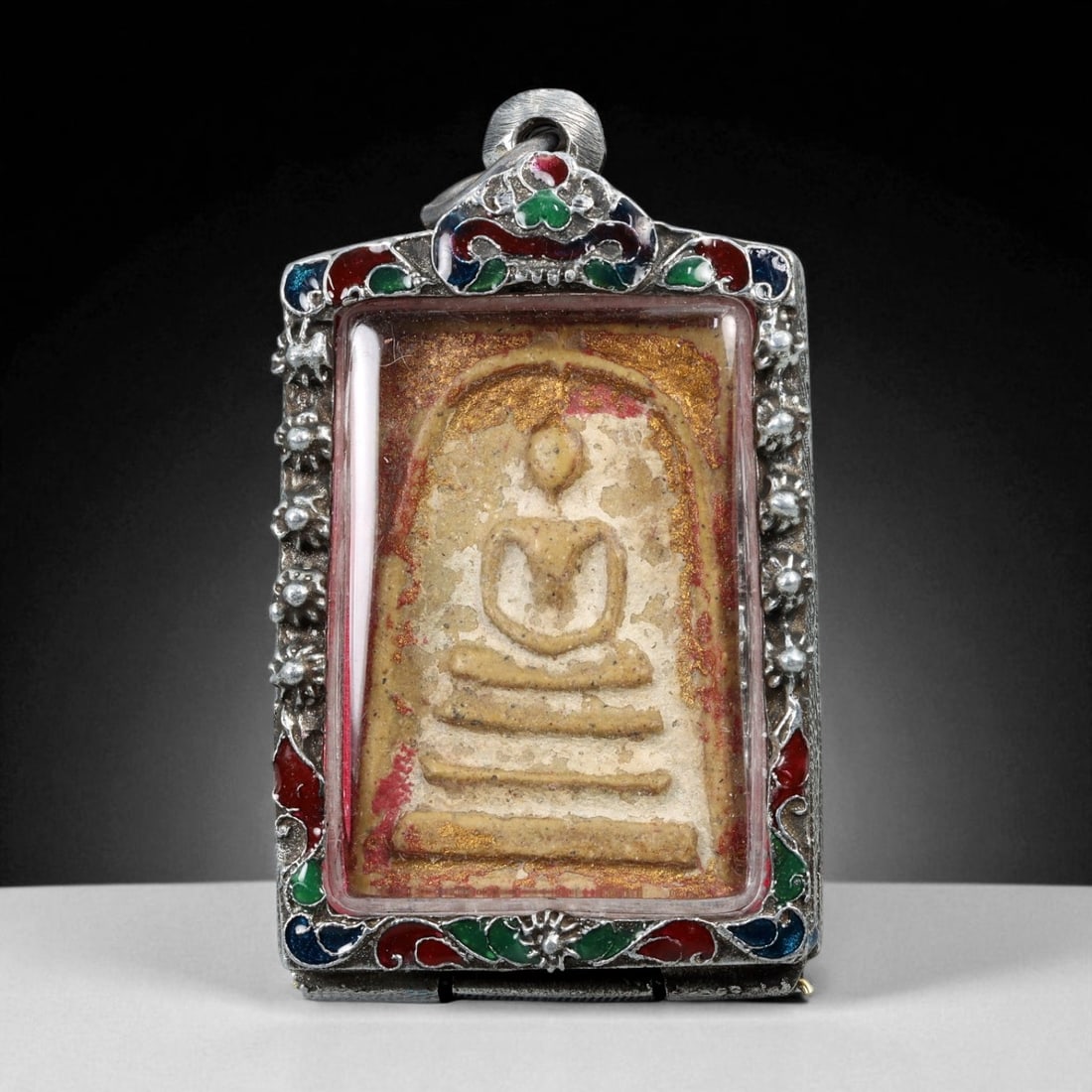 Vintage Thai Buddhist Amulet in Ornate Framed Setting, 20th Century, 6cm: This vintage Thai Buddhist amulet exemplifies the devotional artistry that continues to define Thailand's sacred craftsmanship. Encased within an intricately detailed frame, the amulet displays refine