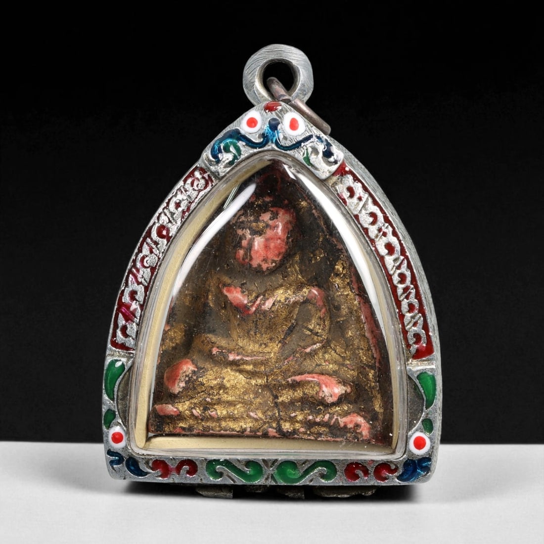 Vintage Thai Buddhist Amulet in Ornate Framed Setting, 20th Century, 6cm: This vintage Thai Buddhist amulet exemplifies the devotional artistry that continues to define Thailand's sacred craftsmanship. Encased within an intricately detailed frame, the amulet displays refine