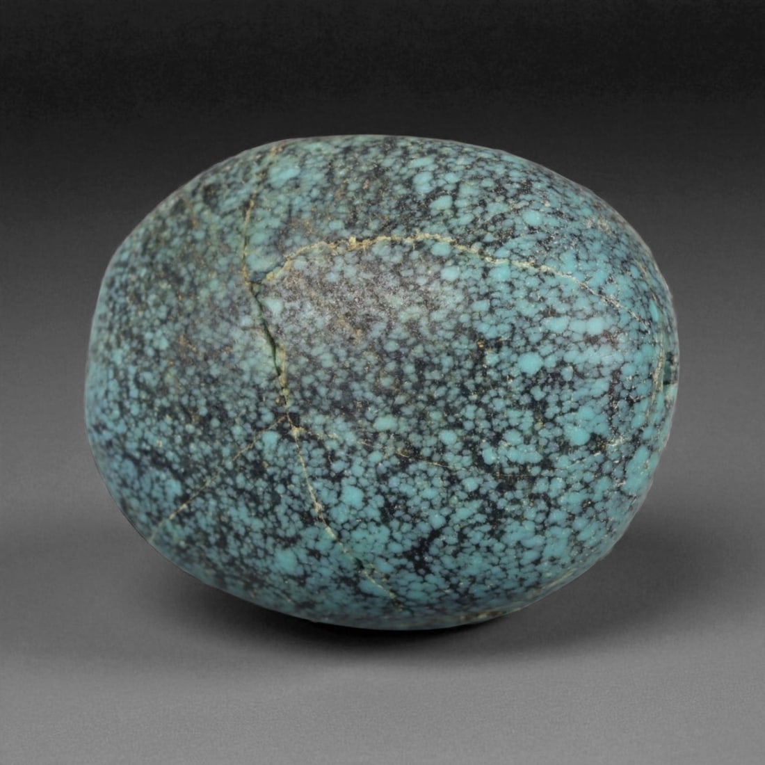 Antique Tibetan Mala Prayer Turquoise Amulet Bead, c. 18th-19th Century, 2.2cm, 7g: This striking turquoise bead from Tibet, dating to the 18th-19th century, embodies the deep spiritual and cultural reverence accorded to this precious stone in Himalayan tradition. Its organic, rounde