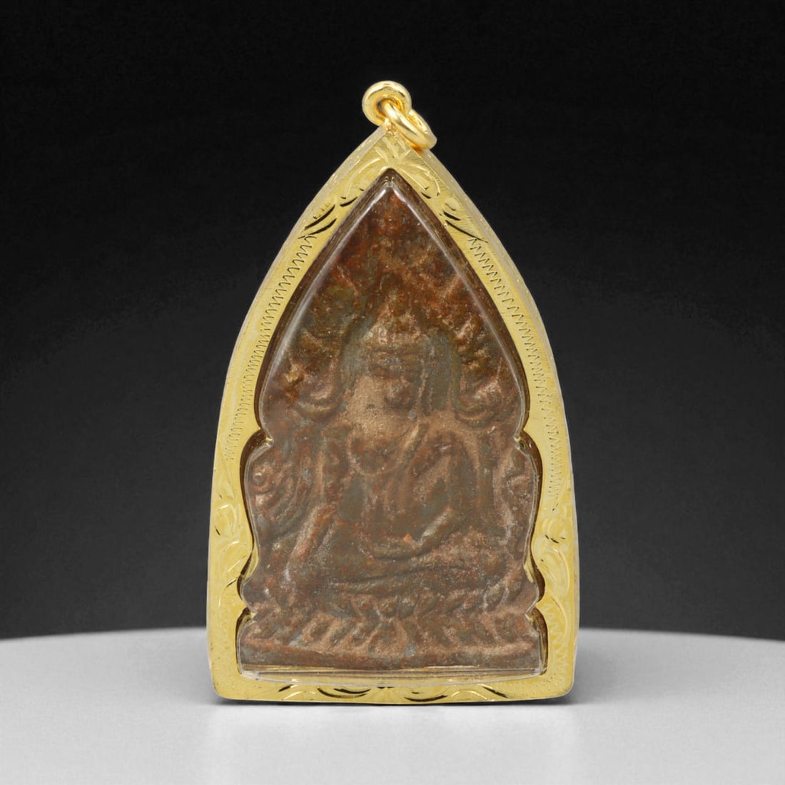 Thai Temple Gilt Buddhist Amulet in Ornate Gold-Tone Frame, 7cm: This beautifully crafted gilt Buddhist amulet is enclosed within an intricately designed gold-tone frame, combining sacred symbolism with refined artistry. The detailed relief and lustrous finish refl