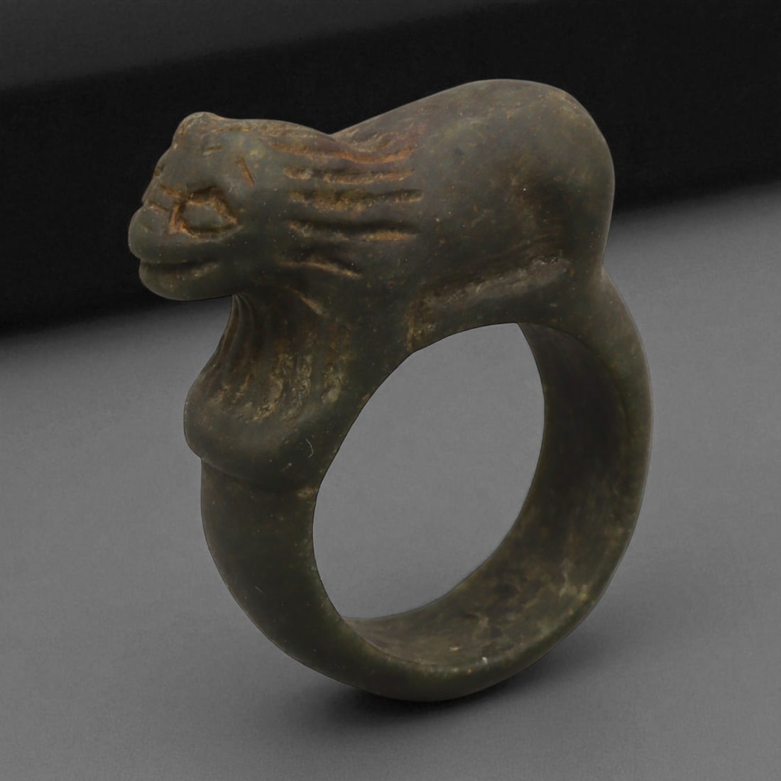 Ancient Parthian Lion-Form Steatite Ring, c. 2nd-1st Century BCE, 3.6 cm: This striking ring, carved from dense steatite and shaped into the form of a prowling lion, dates to the Parthian Empire-an era that bridged Hellenistic refinement and Persian grandeur. The Parthians,