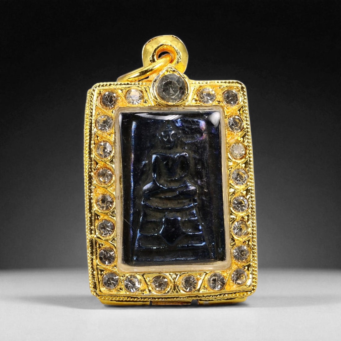 Thai Temple Style Gilt Buddhist Amulet in Ornate Gold-Tone Frame, 4.5cm: This beautifully crafted gilt Buddhist amulet is enclosed within an intricately designed gold-tone frame, combining sacred symbolism with refined artistry. The detailed relief and lustrous finish refl
