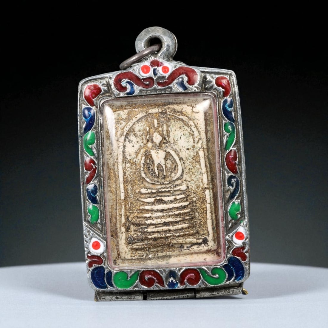 Vintage Thai Buddhist Amulet in Ornate Framed Setting, 20th Century, 6cm: This vintage Thai Buddhist amulet exemplifies the devotional artistry that continues to define Thailand's sacred craftsmanship. Encased within an intricately detailed frame, the amulet displays refine