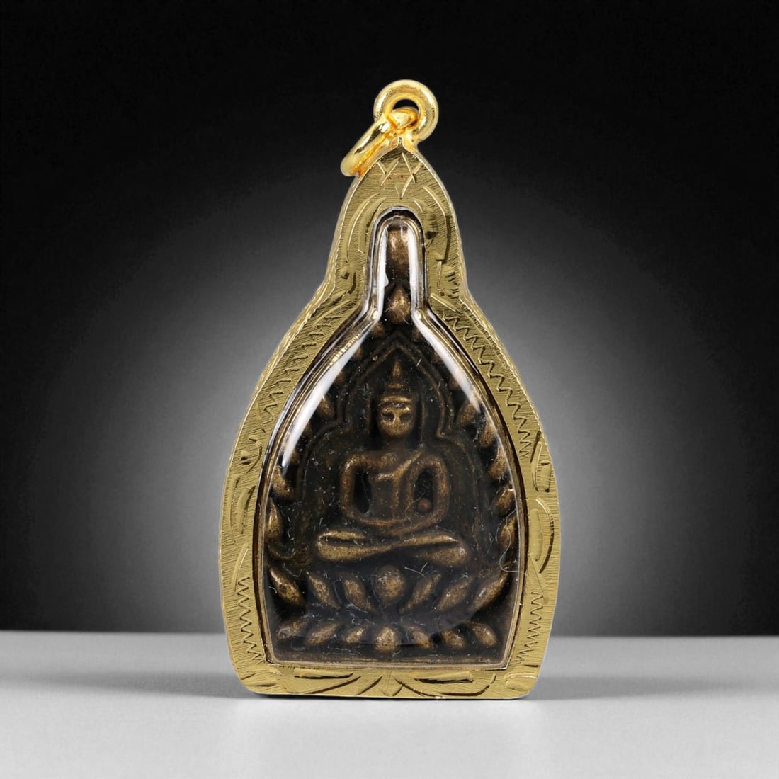 Thai Temple Style Gilt Buddhist Amulet in Ornate Gold-Tone Frame, 5.4cm: This beautifully crafted gilt Buddhist amulet is enclosed within an intricately designed gold-tone frame, combining sacred symbolism with refined artistry. The detailed relief and lustrous finish refl