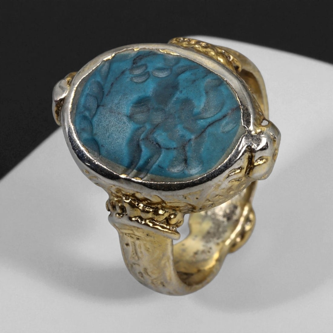 Antique Qajar Gold Gilt Intaglio Signet Ring, c. 19th-20th Century, 9 US, 13g: This substantial gilt ring, dating to the Qajar era of the 19th-20th century, embodies the regal aesthetic and cultural refinement of Persian jewelry traditions. The bezel is set with an engraved inta