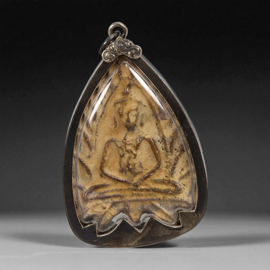 Vintage Thai Buddhist Amulet in Ornate Framed Setting, 20th Century, 6cm: This vintage Thai Buddhist amulet exemplifies the devotional artistry that continues to define Thailand's sacred craftsmanship. Encased within an intricately detailed frame, the amulet displays refine
