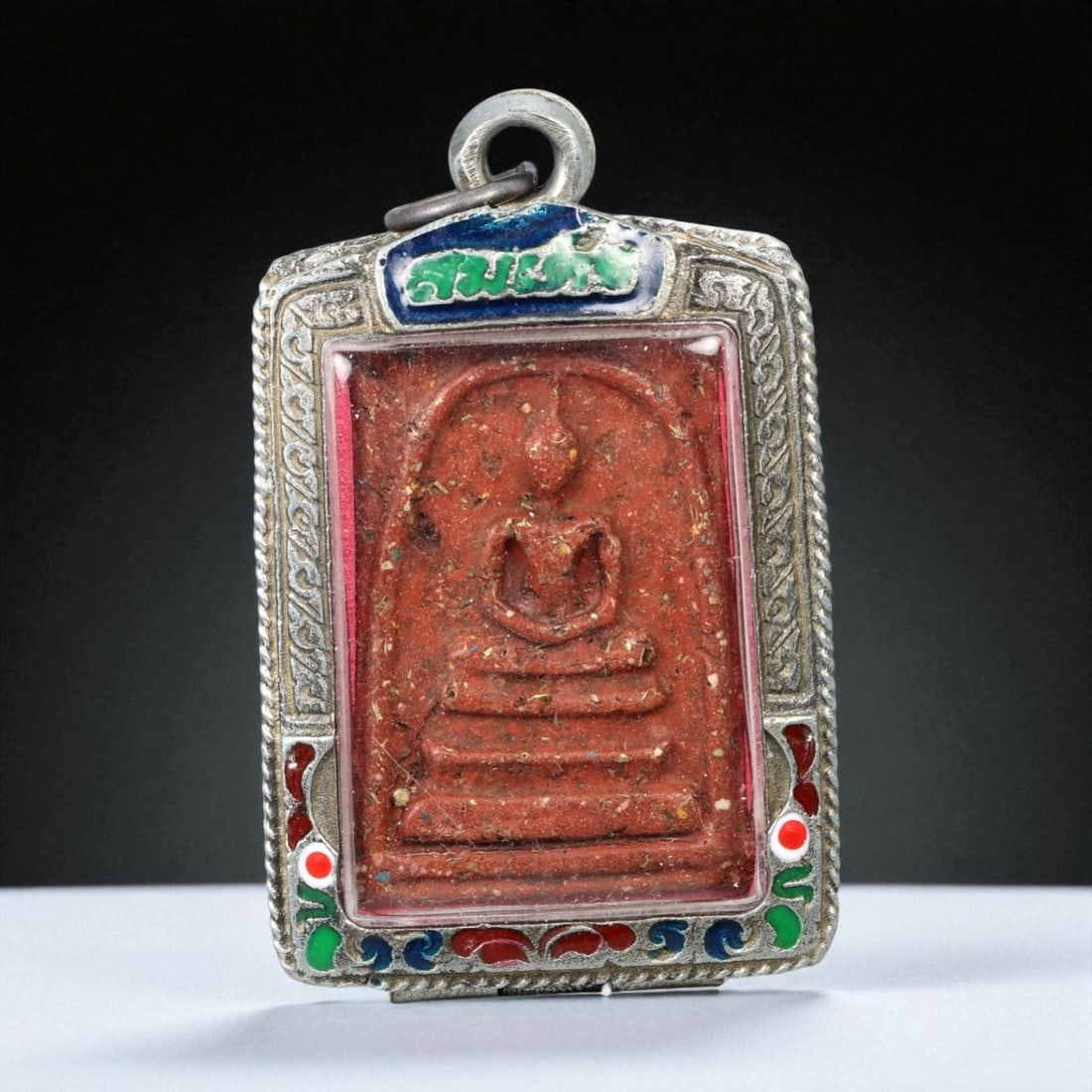 Vintage Thai Buddhist Amulet in Ornate Framed Setting, 20th Century, 6cm: This vintage Thai Buddhist amulet exemplifies the devotional artistry that continues to define Thailand's sacred craftsmanship. Encased within an intricately detailed frame, the amulet displays refine