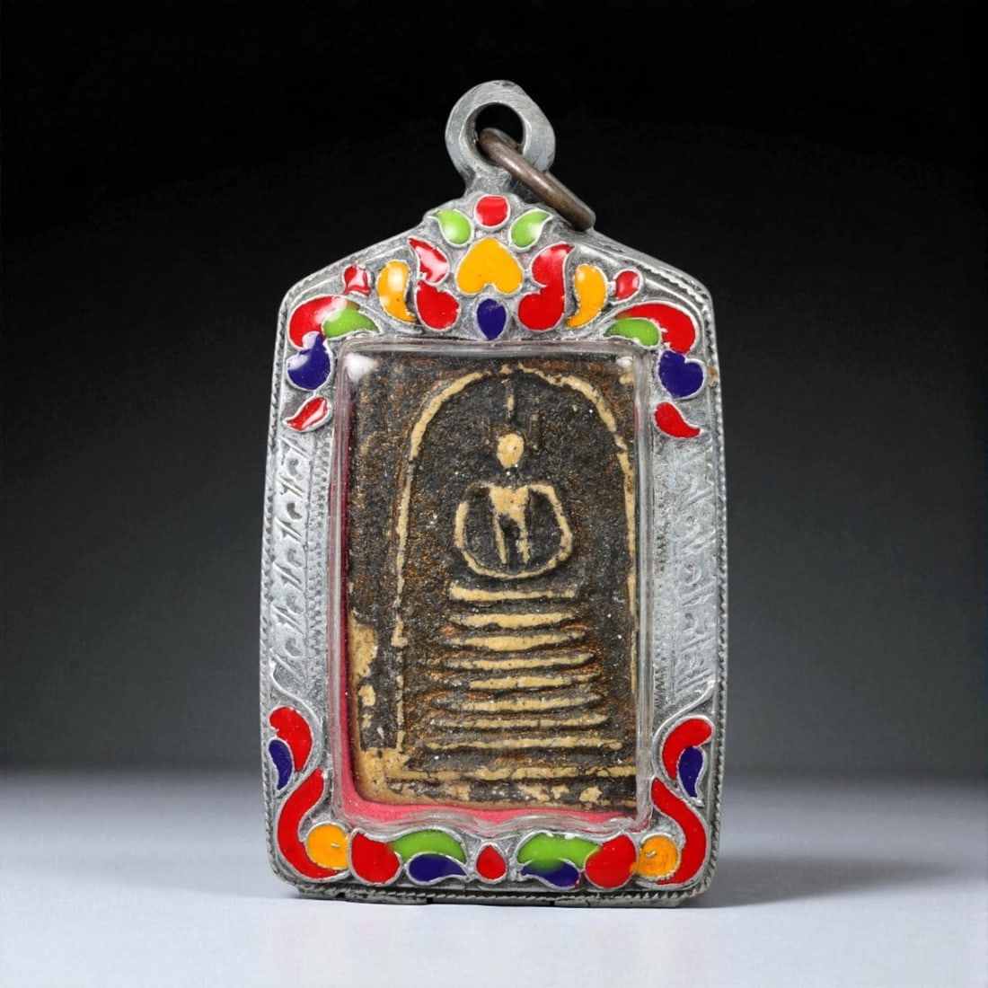 Vintage Thai Buddhist Amulet in Ornate Framed Setting, 20th Century, 6cm: This vintage Thai Buddhist amulet exemplifies the devotional artistry that continues to define Thailand's sacred craftsmanship. Encased within an intricately detailed frame, the amulet displays refine